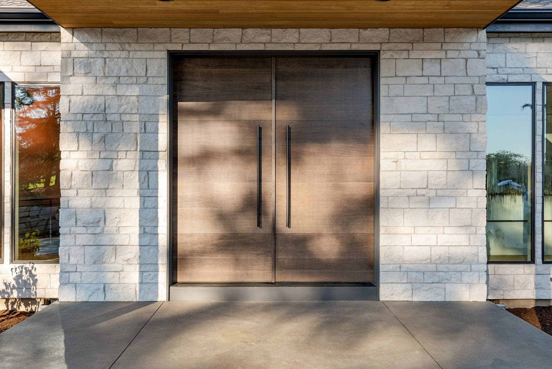 Double wood entry door installation by NexVue Exteriors Denver