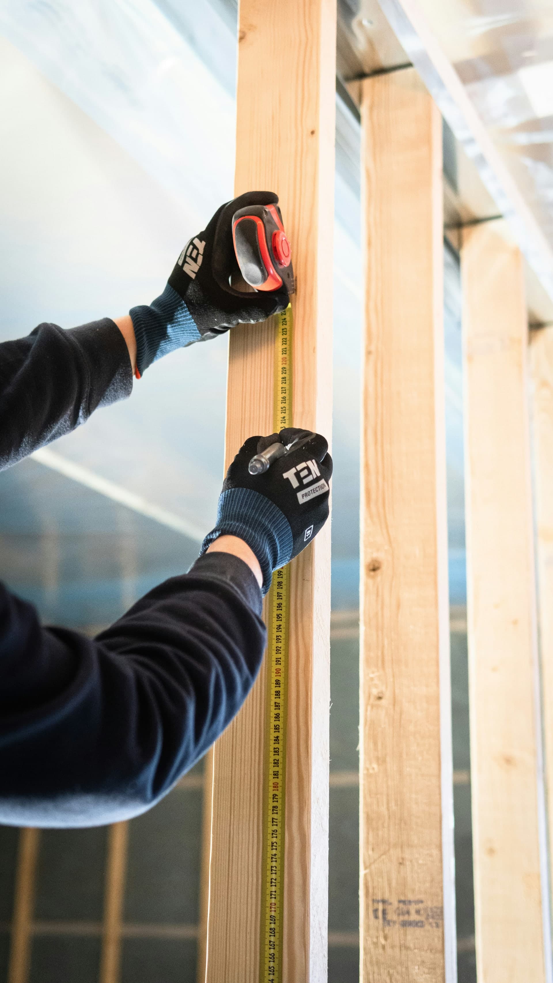 NexVue Exteriors craftsman measuring — precision installation in Denver