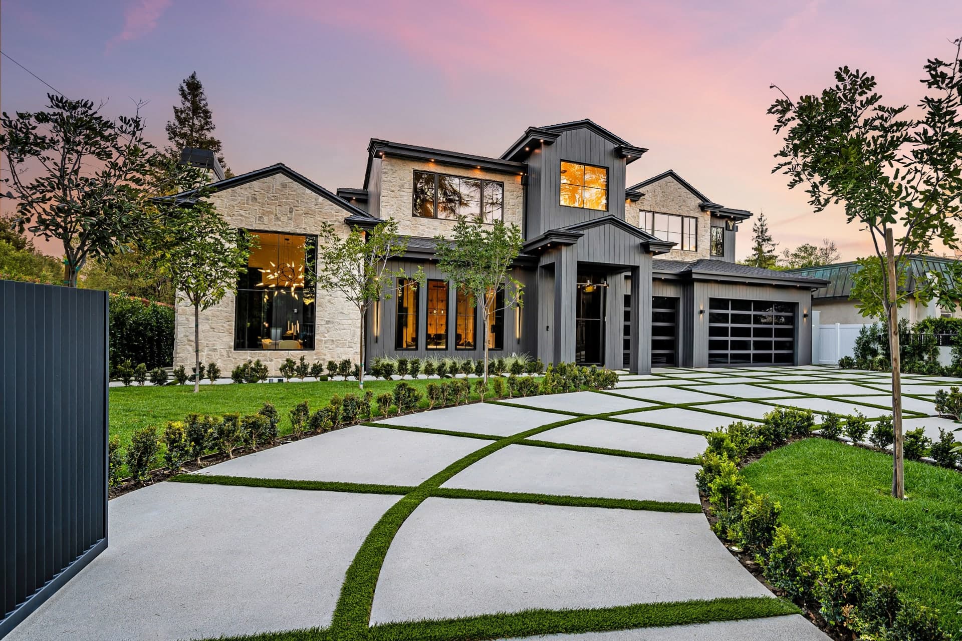 Premium home with glass garage doors — NexVue Exteriors Denver